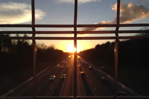 Sand dunes with dramatic sunrise colors and sharp shadows