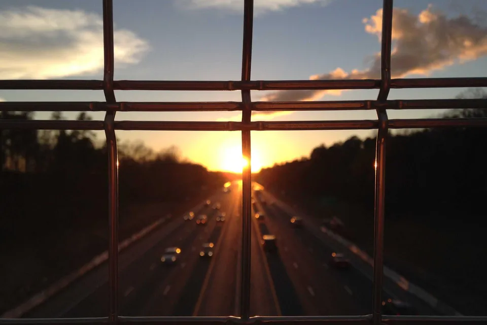 Sand dunes with dramatic sunrise colors and sharp shadows