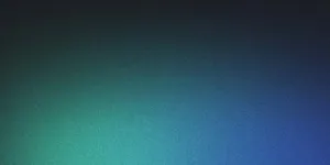 Mountain peaks at dawn with pink sky and morning mist in valleys