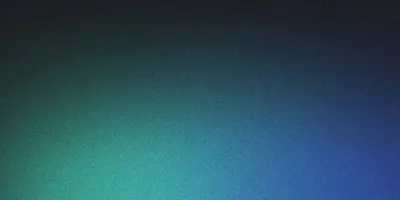 Mountain peaks at dawn with pink sky and morning mist in valleys