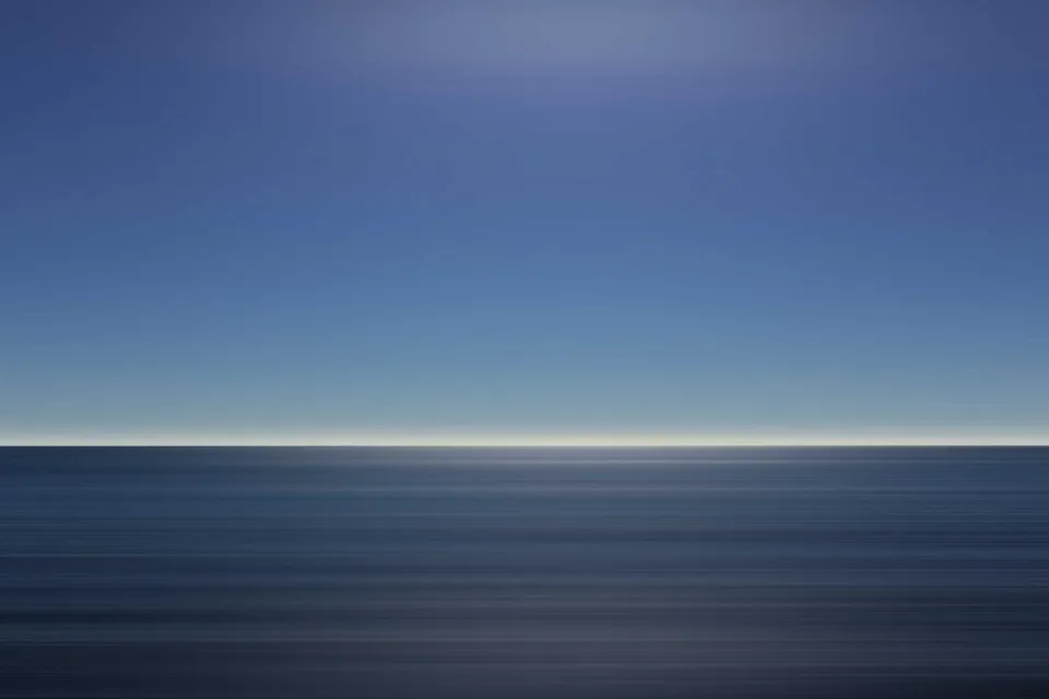 Dramatic ocean cliffs at sunset with crashing waves