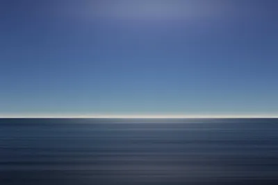 Dramatic ocean cliffs at sunset with crashing waves