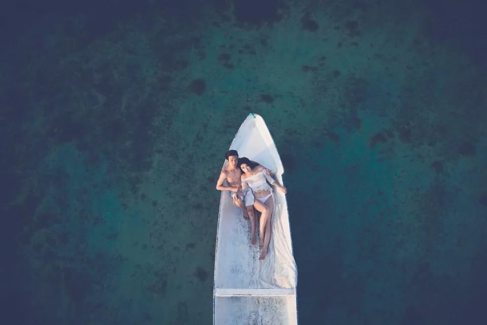 Camel caravan silhouette against desert sunset