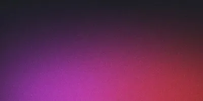 Illuminated city skyline at night with reflections on water